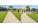 Community pool area featuring a restroom facility and well-maintained landscaping at 981 Fiesta Key Cir, Lady Lake, FL 32159