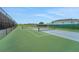Well-maintained tennis courts with green and blue surfaces, perfect for recreational and competitive play at 981 Fiesta Key Cir, Lady Lake, FL 32159