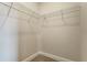 A walk-in closet with ample shelving awaits organization with its clean and functional design at 981 Fiesta Key Cir, Lady Lake, FL 32159