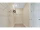A walk-in closet features built-in wire shelving, providing storage solutions within a compact space at 981 Fiesta Key Cir, Lady Lake, FL 32159