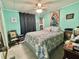 Tranquil bedroom featuring a comfortable bed and charming decor, creating a peaceful retreat at 101 Royal Palm Dr, Leesburg, FL 34748
