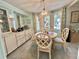 Cozy dining area features built-in cabinets and a round table perfect for intimate meals at 101 Royal Palm Dr, Leesburg, FL 34748