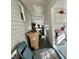 Hallway with utility closet space and natural light; can be used for storage with additional shelving at 101 Royal Palm Dr, Leesburg, FL 34748