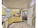 Functional kitchen features light cabinetry and hard surface flooring at 101 Royal Palm Dr, Leesburg, FL 34748