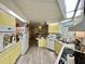 Efficient kitchen features light cabinetry and an open layout at 101 Royal Palm Dr, Leesburg, FL 34748