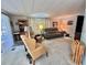 Comfortable living room with ample seating, perfect for relaxing and entertaining guests at 101 Royal Palm Dr, Leesburg, FL 34748