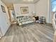 Bright living room featuring a ceiling fan and hard surface flooring at 101 Royal Palm Dr, Leesburg, FL 34748