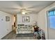 Bright living room featuring a ceiling fan and hard surface flooring at 101 Royal Palm Dr, Leesburg, FL 34748