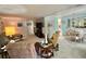 Spacious living spaces seamlessly flow together, offering comfortable areas for relaxation and dining at 101 Royal Palm Dr, Leesburg, FL 34748