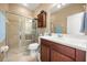 Bright bathroom features a glass door shower and a modern vanity at 1023 Timbervale Trl, Clermont, FL 34715