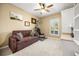 Bedroom/Flex Space with a comfortable couch, fitness machine, and bright window at 1023 Timbervale Trl, Clermont, FL 34715