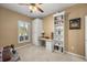 Bedroom/Flex Space with a comfortable couch, built-in desk, and bright window at 1023 Timbervale Trl, Clermont, FL 34715