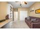 Bedroom/Flex Space with a comfortable couch, built-in shelving, and bright window at 1023 Timbervale Trl, Clermont, FL 34715