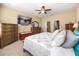 Serene bedroom with a ceiling fan, a television, and classic furniture at 1023 Timbervale Trl, Clermont, FL 34715