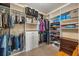 Organized walk-in closet with shelving, hanging racks, and ample storage space at 1023 Timbervale Trl, Clermont, FL 34715