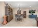Cozy dining area featuring a round table, chandelier lighting, and elegant decor at 1023 Timbervale Trl, Clermont, FL 34715