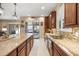 Bright kitchen with granite countertops, stainless steel appliances, and an open layout at 1023 Timbervale Trl, Clermont, FL 34715