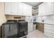 Spacious laundry room with modern washer, dryer, storage cabinets, and counters at 1023 Timbervale Trl, Clermont, FL 34715