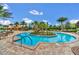 Stunning zero entry pool with a central island and mature landscaping, offering a resort-like atmosphere at 1023 Timbervale Trl, Clermont, FL 34715