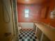Bathroom featuring bright orange walls and a walk in shower at 103 Caroline Ave, Lady Lake, FL 32159