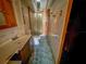 Bathroom with sink, vanity, toilet and shower stall at 103 Caroline Ave, Lady Lake, FL 32159