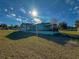 View of the house and yard from the front yard on a sunny day at 103 Caroline Ave, Lady Lake, FL 32159