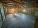 Garage with shelves and exposed beams at 103 Caroline Ave, Lady Lake, FL 32159