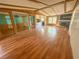 Spacious living room with wood floors and fireplace at 103 Caroline Ave, Lady Lake, FL 32159