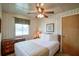 Comfortable bedroom featuring a ceiling fan, a queen bed, and neutral decor at 10301 Us Highway 27 # 84, Clermont, FL 34711