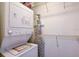 Compact laundry room with a stacked washer and dryer and wire shelving at 10301 Us Highway 27 # 84, Clermont, FL 34711