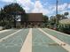 Community shuffleboard courts with shaded seating areas, perfect for recreation and socializing at 10301 Us Highway 27 # 84, Clermont, FL 34711