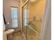 Bathroom features a walk-in shower and ample natural light, perfect for a relaxing experience at 111 Azalea Trl, Leesburg, FL 34748