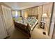 Comfortable bedroom features neutral tones, a cozy bed, and closet for storage at 111 Azalea Trl, Leesburg, FL 34748