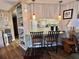Breakfast bar showcases pendant lighting and connects to a spacious kitchen with modern appliances at 111 Azalea Trl, Leesburg, FL 34748