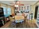 Cozy dining area features a round table, built-in cabinets, and a ceiling fan at 111 Azalea Trl, Leesburg, FL 34748