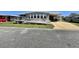 Charming single-story home featuring a convenient carport and an access ramp for easy entry at 111 Azalea Trl, Leesburg, FL 34748