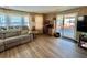 Cozy living area with a work desk, comfortable seating, and natural light at 111 Azalea Trl, Leesburg, FL 34748