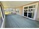 Enclosed patio boasts sliding glass doors and views of the yard, creating a relaxing outdoor space at 111 Azalea Trl, Leesburg, FL 34748