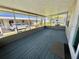 Relaxing screened in patio with textured floors providing an outdoor living space at 111 Azalea Trl, Leesburg, FL 34748