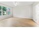 Bright bedroom with a ceiling fan and large window allowing natural light at 11759 Se 91St Cir, Summerfield, FL 34491