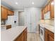 Bright kitchen showcasing wood cabinets, white appliances and spacious island at 11759 Se 91St Cir, Summerfield, FL 34491