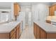 Well-lit kitchen featuring wood cabinetry and center island with counter seating at 11759 Se 91St Cir, Summerfield, FL 34491