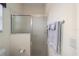 Bathroom with shower, towel rack, and toilet paper holder at 1417 Forest Acres Dr, The Villages, FL 32162