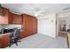 Bedroom features Murphy bed with desk, ceiling fan, and window at 1417 Forest Acres Dr, The Villages, FL 32162