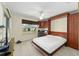 Bedroom featuring Murphy bed partially open, window, and ceiling fan at 1417 Forest Acres Dr, The Villages, FL 32162