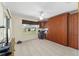 Bedroom featuring murphy bed, window, and ceiling fan at 1417 Forest Acres Dr, The Villages, FL 32162