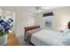 Bedroom showcasing comfortable furnishings, a window with natural light, and a relaxing ambiance at 1417 Forest Acres Dr, The Villages, FL 32162