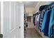 Walk-in closet features ample storage space with shelves and clothing rods, perfect for organization at 1417 Forest Acres Dr, The Villages, FL 32162