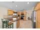 Spacious kitchen with stainless steel appliances, ample counter space, and breakfast bar seating at 1417 Forest Acres Dr, The Villages, FL 32162