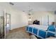 Bright main bedroom showcasing hardwood floors, a ceiling fan, and plenty of natural light at 1417 Forest Acres Dr, The Villages, FL 32162